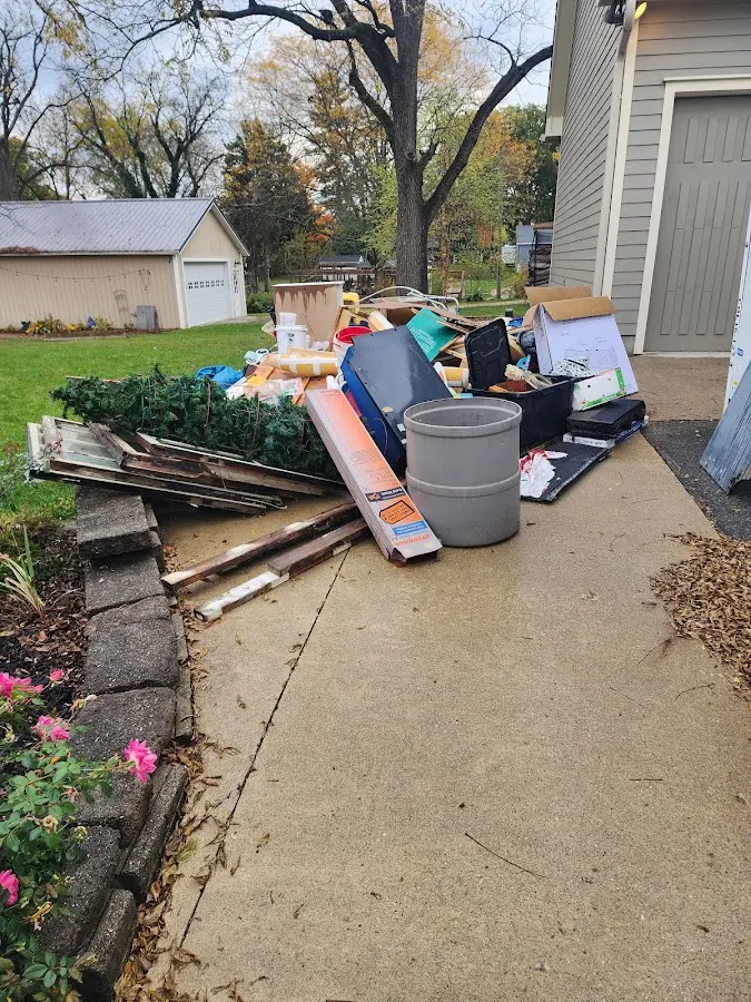 Dumpster being loaded with debris for Commercial Dumpster Rental in Hidden Valley Lake